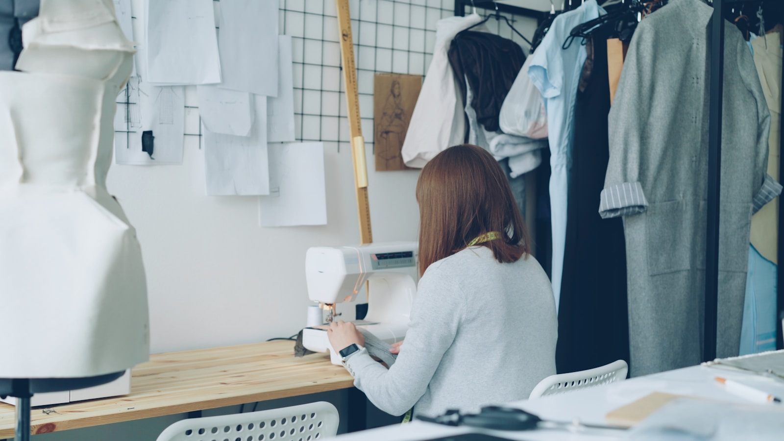 Illustrative garment maker at work, representing Leetu Fashion's manufacturing heritage